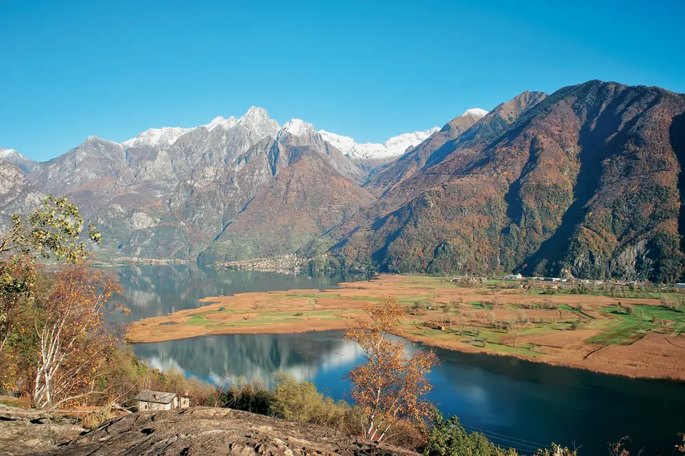 panoramic view lake snow capped mountains