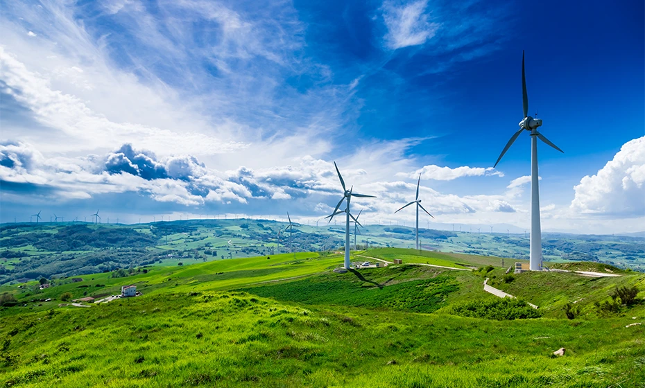 overview wind farm on green hills
