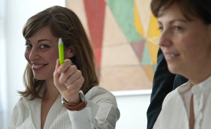 employee smiles hand pen