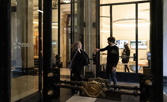 people exiting edison building main entrance