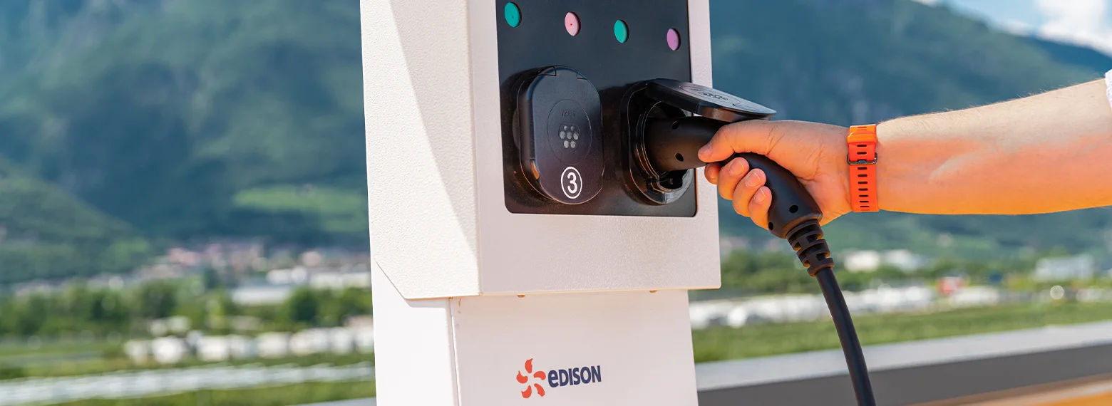 Hand Edison electric car charging station 
