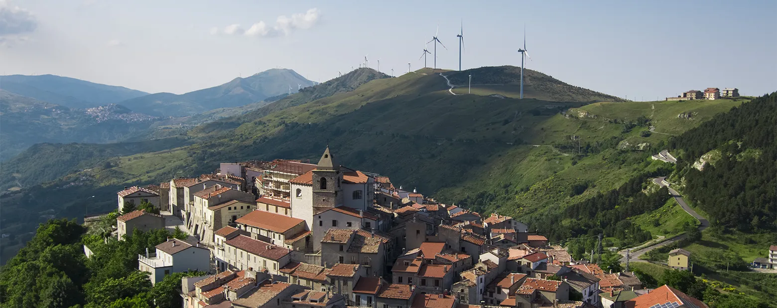 view of village on hill wind plant